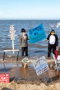 Climate change protestors on Cleethorpes beach