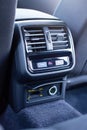Climate control unit for rear passengers in a car with a 220 volt socket Royalty Free Stock Photo