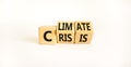 Climate crisis and change symbol. Turned wooden cubes with words `Climate crisis`. Beautiful white background. Climate change an