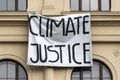 Climate Justice Banner outside building Royalty Free Stock Photo
