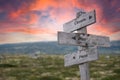 Climate plan focus text engraved in wooden signpost outdoors in nature during sunset