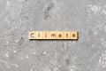 Climate word written on wood block. climate text on cement table for your desing, concept Royalty Free Stock Photo
