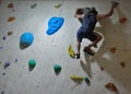 Climber in action, concentration before a difficult jump Royalty Free Stock Photo