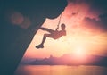 Climber against red sunset. Instagram stylisation Royalty Free Stock Photo