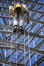 Climber ascending cell phone tower Royalty Free Stock Photo