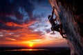 Climber Ascends Cliff at Sunset Over Valley Royalty Free Stock Photo