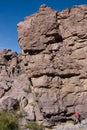 Climber at the base of cliff