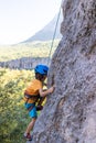 climber boy. the child trains in rock climbing Royalty Free Stock Photo