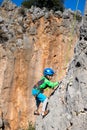 climber boy. the child trains in rock climbing Royalty Free Stock Photo