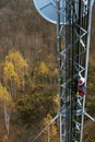 Climber on cell tower Royalty Free Stock Photo