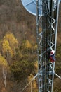 Climber on cell tower Royalty Free Stock Photo