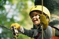 Climber child on training. Cute little boy in climbing safety equipment in a tree house or in a rope park climbs the