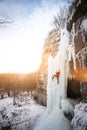 The climber climbs on ice. Royalty Free Stock Photo