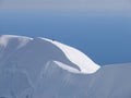 Climber on edge of crater of volcano Beerenberg