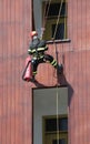 climber Firefighter during a training who enters from the window