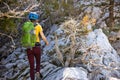 climber goes along the rocky ridge. girl climbing in the mountains. Turkey. the concept of adventure and hiking in the mountains