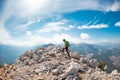 climber goes along the rocky ridge. girl climbing in the mountains. Turkey. the concept of adventure and hiking in the mountains