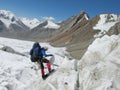 Climber going down from glacier with a rope Royalty Free Stock Photo