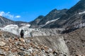 Climber, hiker climbing on the Tre-la-Tete glacier in French Alps, near the Domes-de-Miage and Mont Blanc, on summer sunny day Royalty Free Stock Photo