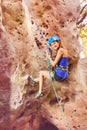 Climber holding harness rope during downclimb