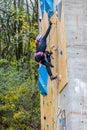 Climber with ice axes climbing on artificial climbing drytooling wall on the Drytool World Cup in Brno Royalty Free Stock Photo