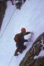 Climber on ice headwall of glacier