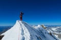 Climber on a knife edge snow mountain ridge Royalty Free Stock Photo