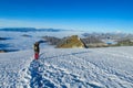 Climber on snow mountain ridge above the clouds Royalty Free Stock Photo