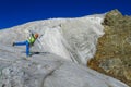 Climber on snow mountain ridge above the clouds Royalty Free Stock Photo