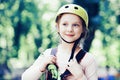 Climber little girl on training. Cute school little girl enjoying a sunny day in a climbing adventure activity park