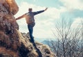 Climber man stay on the edge of deep with view on the mountain v Royalty Free Stock Photo