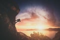 Climber on a rock against sunset. Instagram stylization Royalty Free Stock Photo