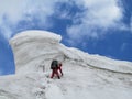 Climber on snow alpinist route Royalty Free Stock Photo