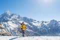 Climber standing near the huge snowy mountain