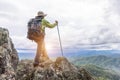 Climber standing on a rock on the mountain