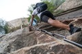 Climber tackling steep stone stairs on Huashan mountain