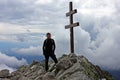 Climber on top of Krivan Peak