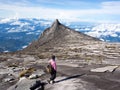 Climber at the top of Mount Kinabalu in Sabah, Malaysia