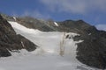 Climber trail through a dangerous glacier and avalanches in Austiran Alps. Route to the Grossglockner rock summit, Austria Royalty Free Stock Photo