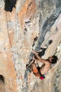 Climber Trying to keep Hold in last Effort to avoid deep fall down