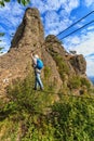 Climber on via ferrata bridge Royalty Free Stock Photo