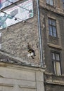 Climber worker renovating the facade of a building. Budapest, Hungary.