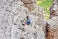 Climbers ascending Sass Pordoi mountain massif, Dolomites Alps, Italy.