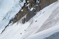 Climbers ascending way up to Aiguille du Midi with details Royalty Free Stock Photo