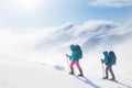 climbers climb the mountain in the snow. Winter mountaineering. two girls in snowshoes walk through the snow. mountaineering Royalty Free Stock Photo