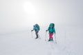 climbers climb the mountain in the snow. Winter mountaineering. two girls in snowshoes walk through the snow. mountaineering Royalty Free Stock Photo