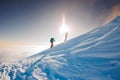 climbers climb the mountain. Winter mountaineering. two girls in snowshoes walk through the snow Royalty Free Stock Photo