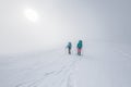 climbers climb the mountain. Winter mountaineering. two girls in snowshoes walk through the snow Royalty Free Stock Photo