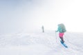 climbers climb the mountain. Winter mountaineering. two girls in snowshoes walk through the snow Royalty Free Stock Photo