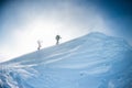 Climbers climb to the top of the mountain in winter Royalty Free Stock Photo